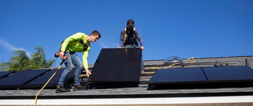 men on top of a roof