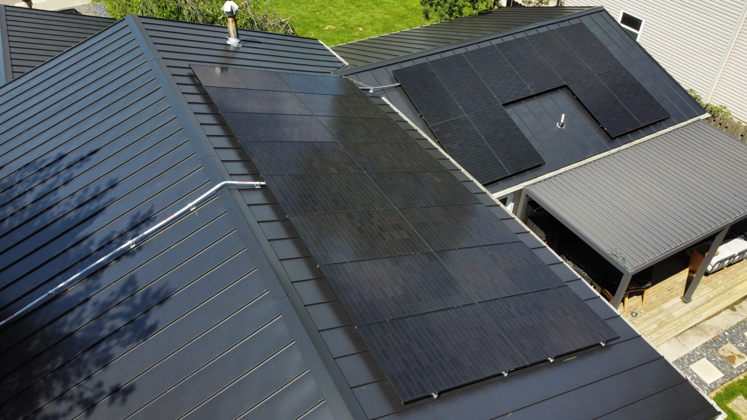 installed solar panel on black roof
